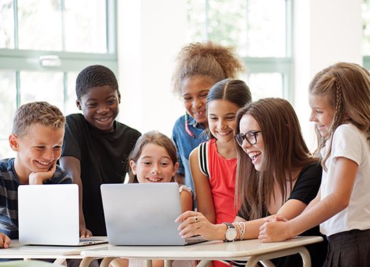School kids on laptop chromebook